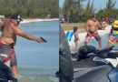 Banhista saca arma para kitesurfista durante briga em praia